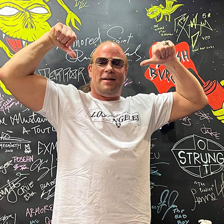 Rob Van Dam showing off the guns.